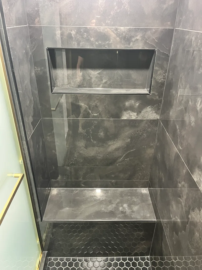 Built-in shower niche and bench, fully tiled over Schluter waterproofing